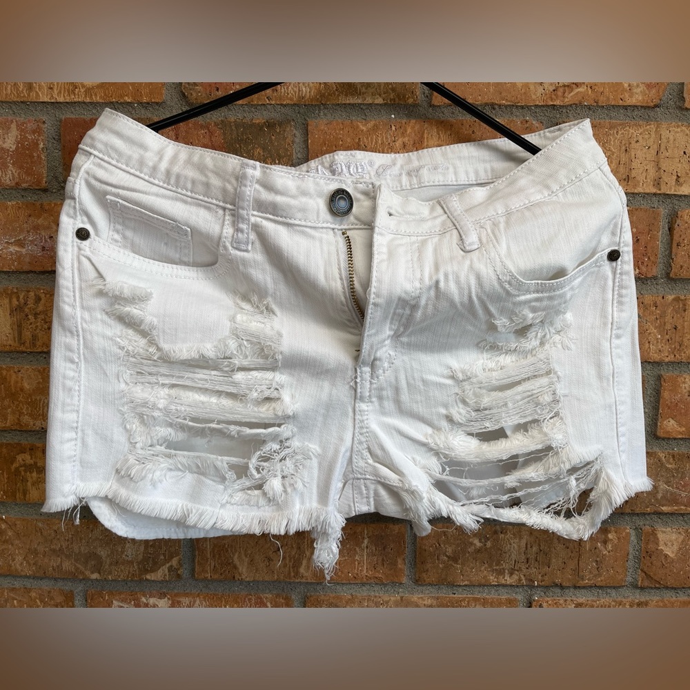 Large white distressed shorts. Denim shorts, never worn